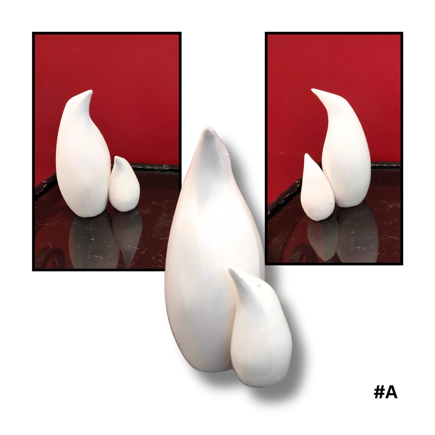 Mother and child White Earthenware Clay Penguin sculpture A, showing three views on a reflective surface with red background