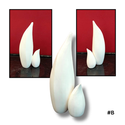 Mother and child White Earthenware Clay Penguin sculpture B, showing three views on a reflective surface with red background