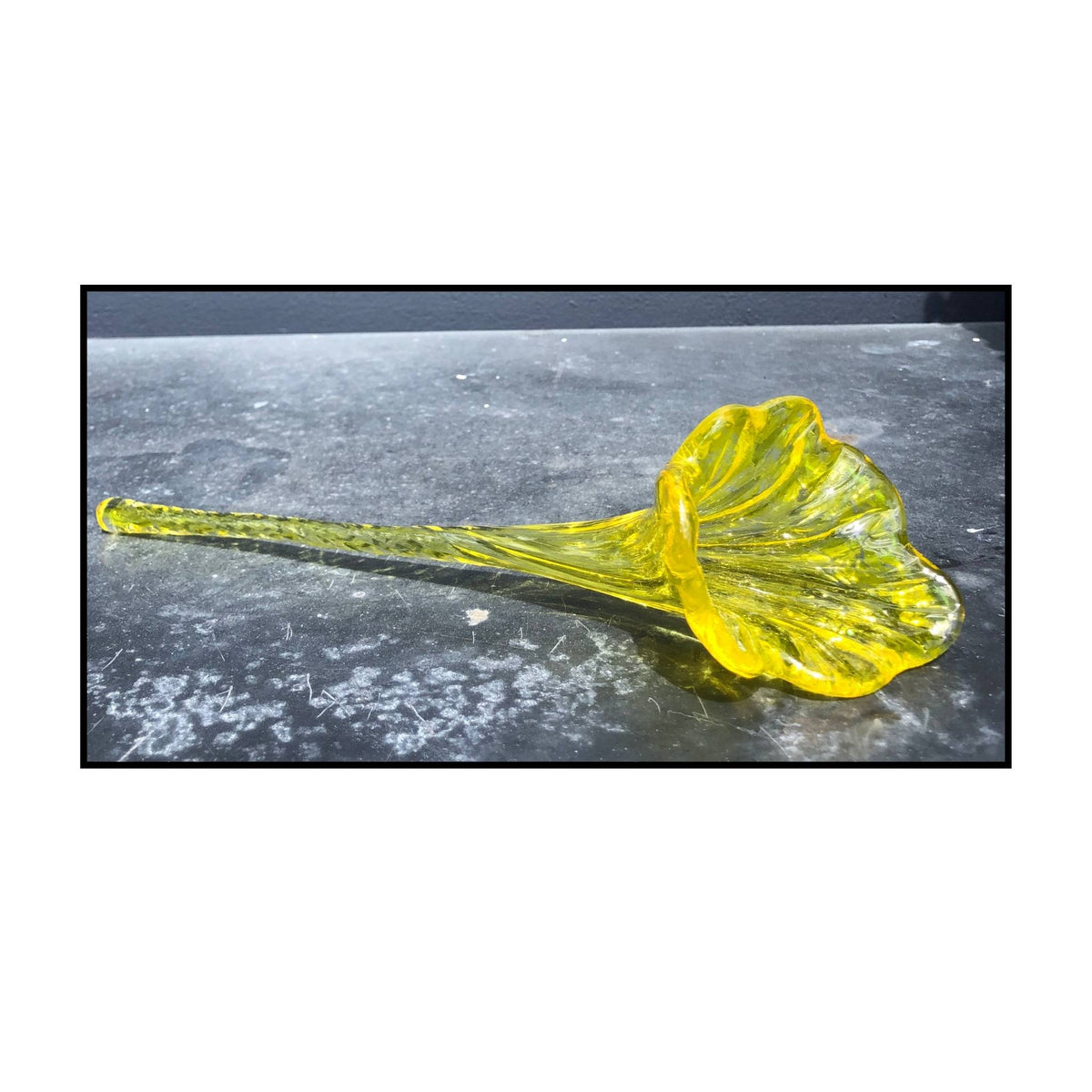 Yellow glass blown flower by Heather Kremen