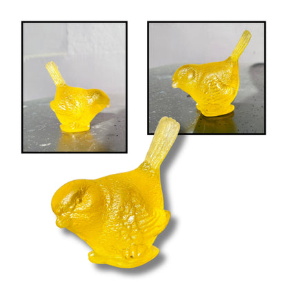 Small cast glass bird sculpture in bright yellow with tail up by Lou Mathieson, 5x4x5cm, on white background
