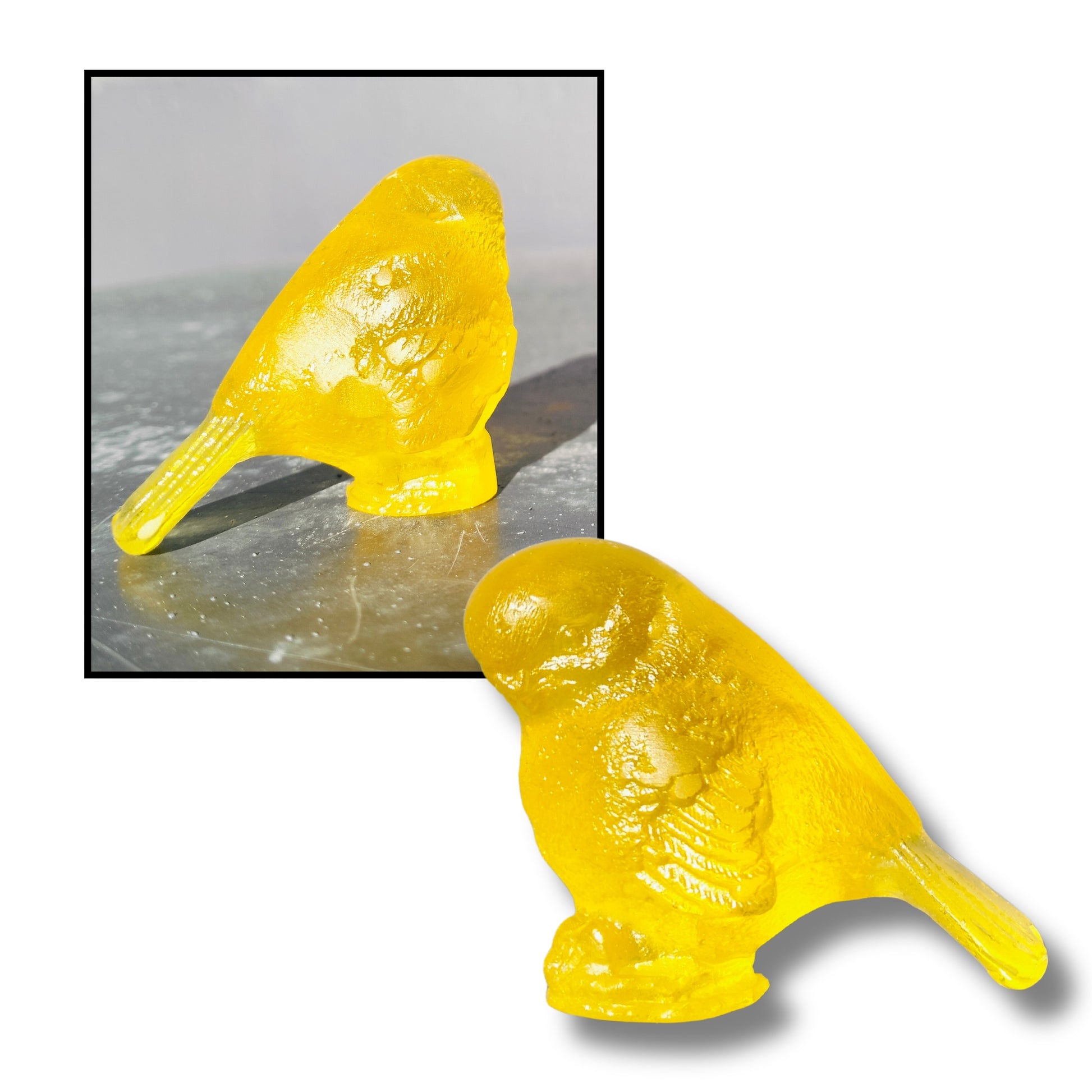 Small cast glass bird sculpture in yellow with tail down by Lou Mathieson, 5x4x4cm, on white background
